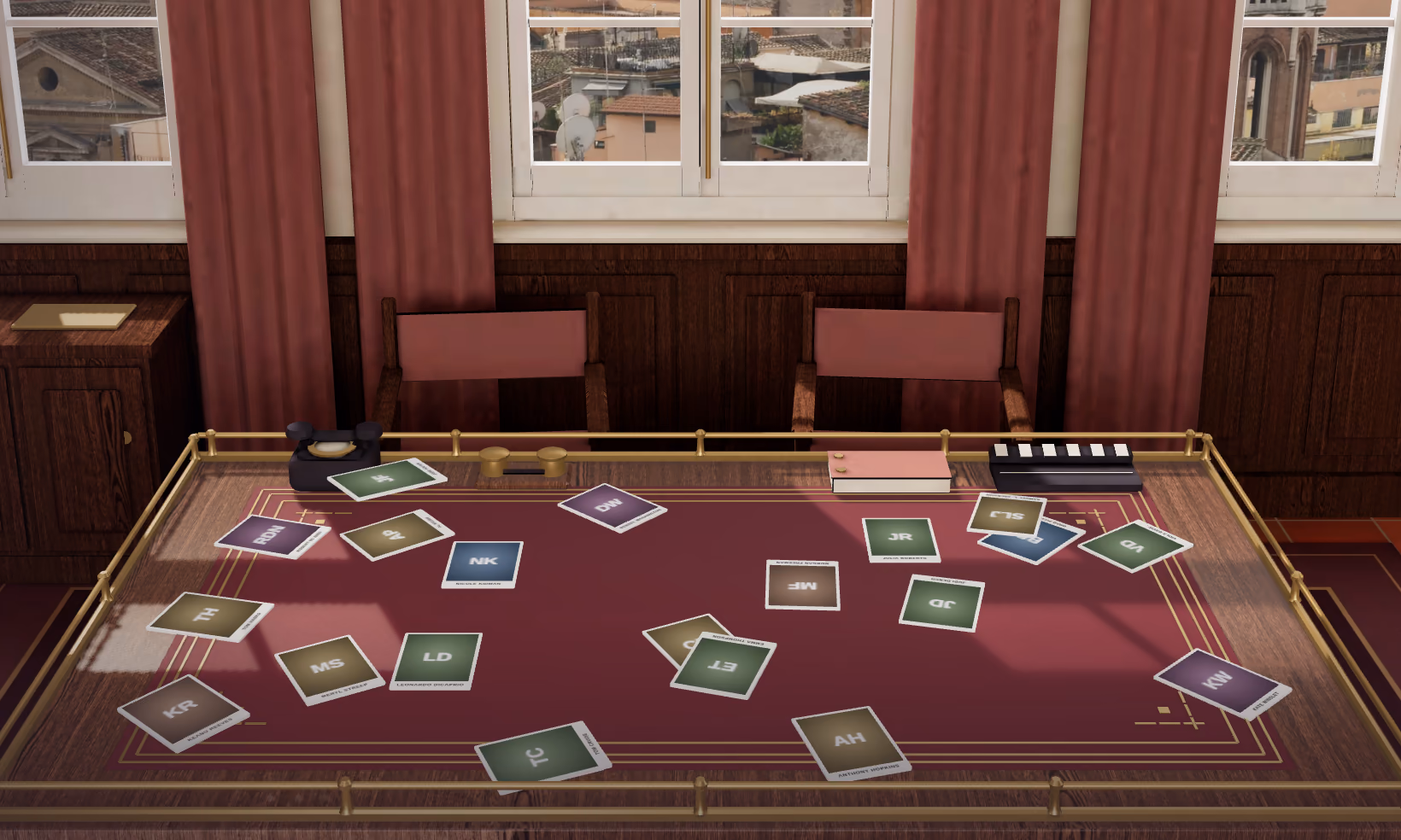 The casting room table with twenty actors' cards spread across it, in front of windows over old rooftops.