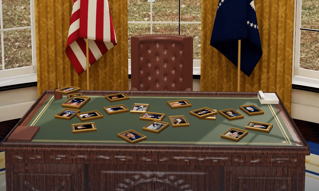 The desk in the Oval Office with twenty framed presidential portraits lying on it.